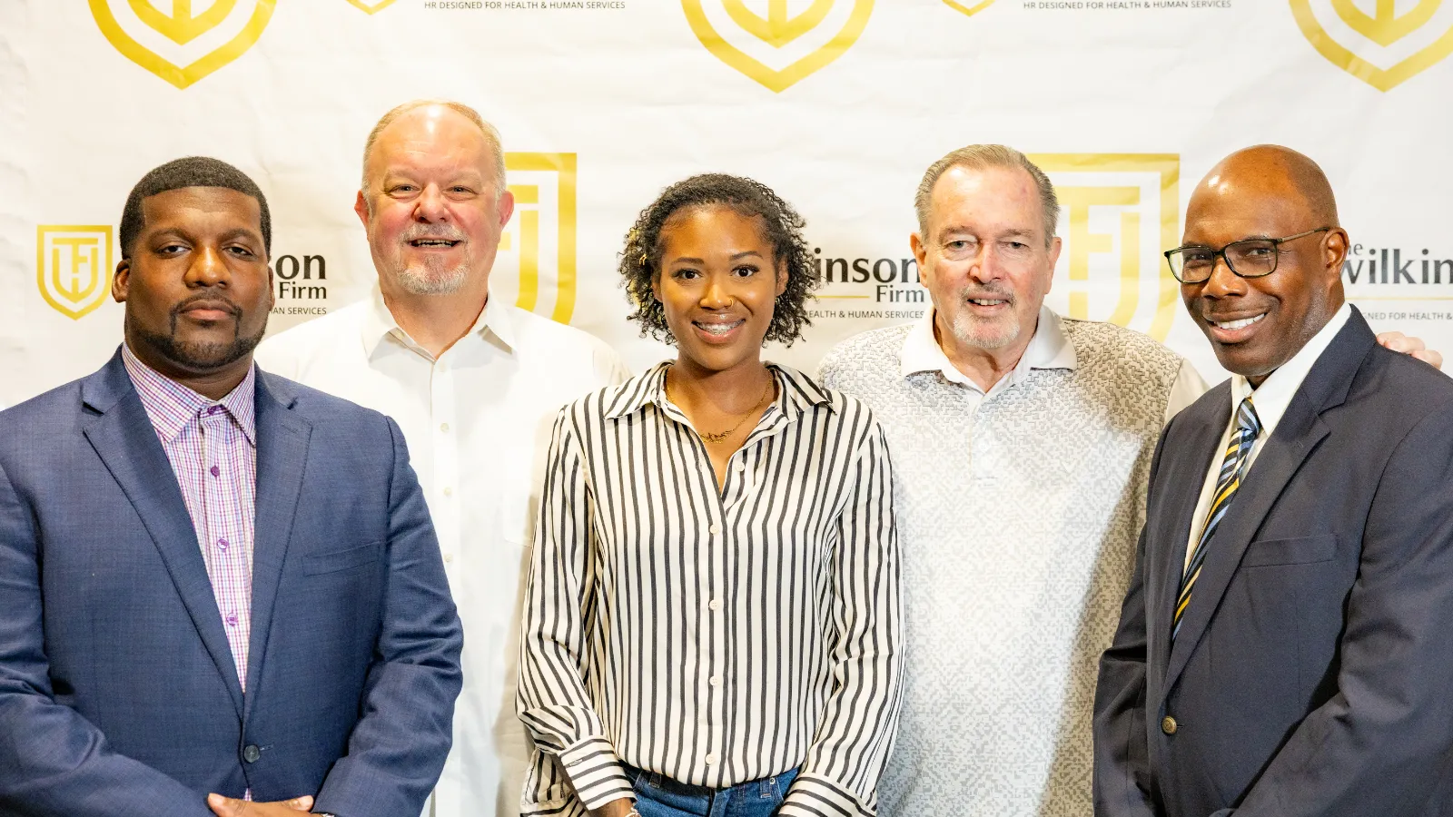 The Wilkinson Firm leadership team standing together